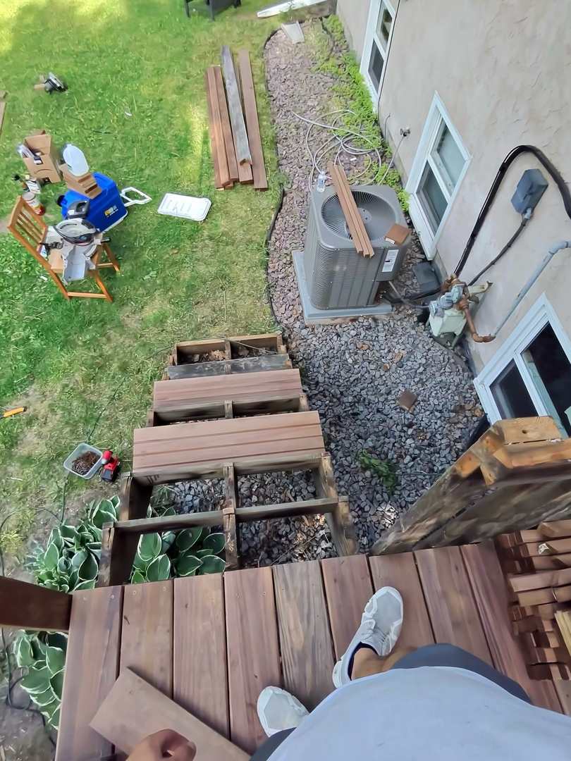 New stair treads being installed on open framing