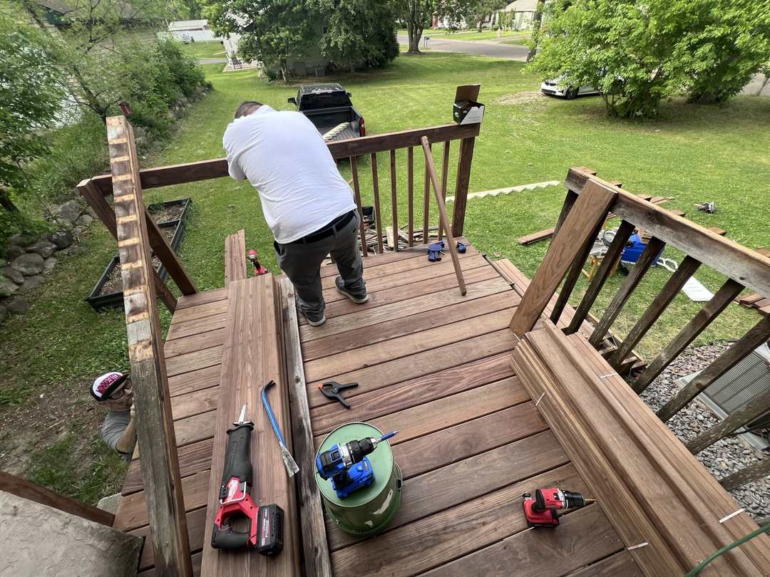 Crew installing new deck stair rails